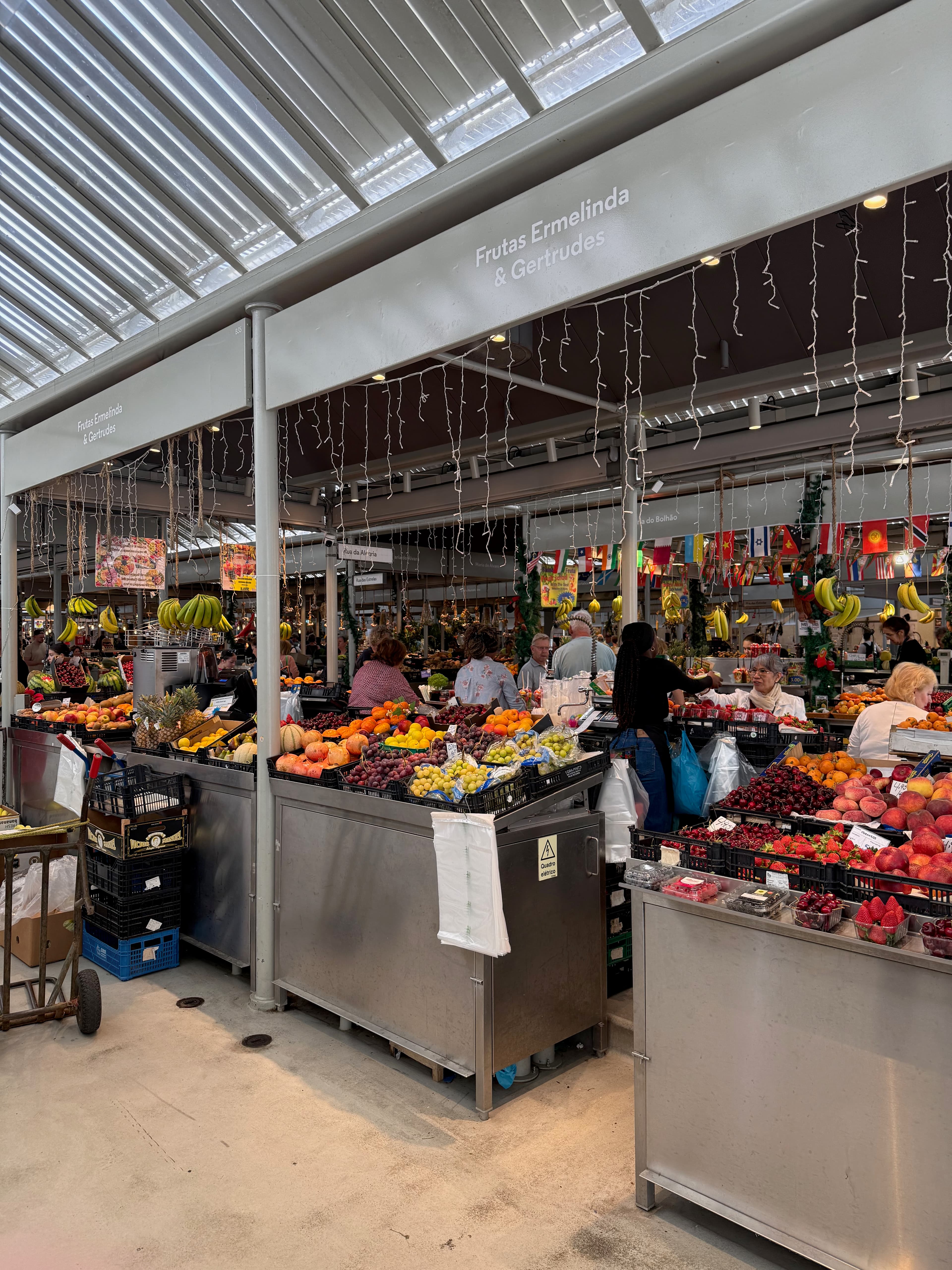 The vibrant fruit and vegetable stalls inside the beautifully restored historic Bolhão Market.