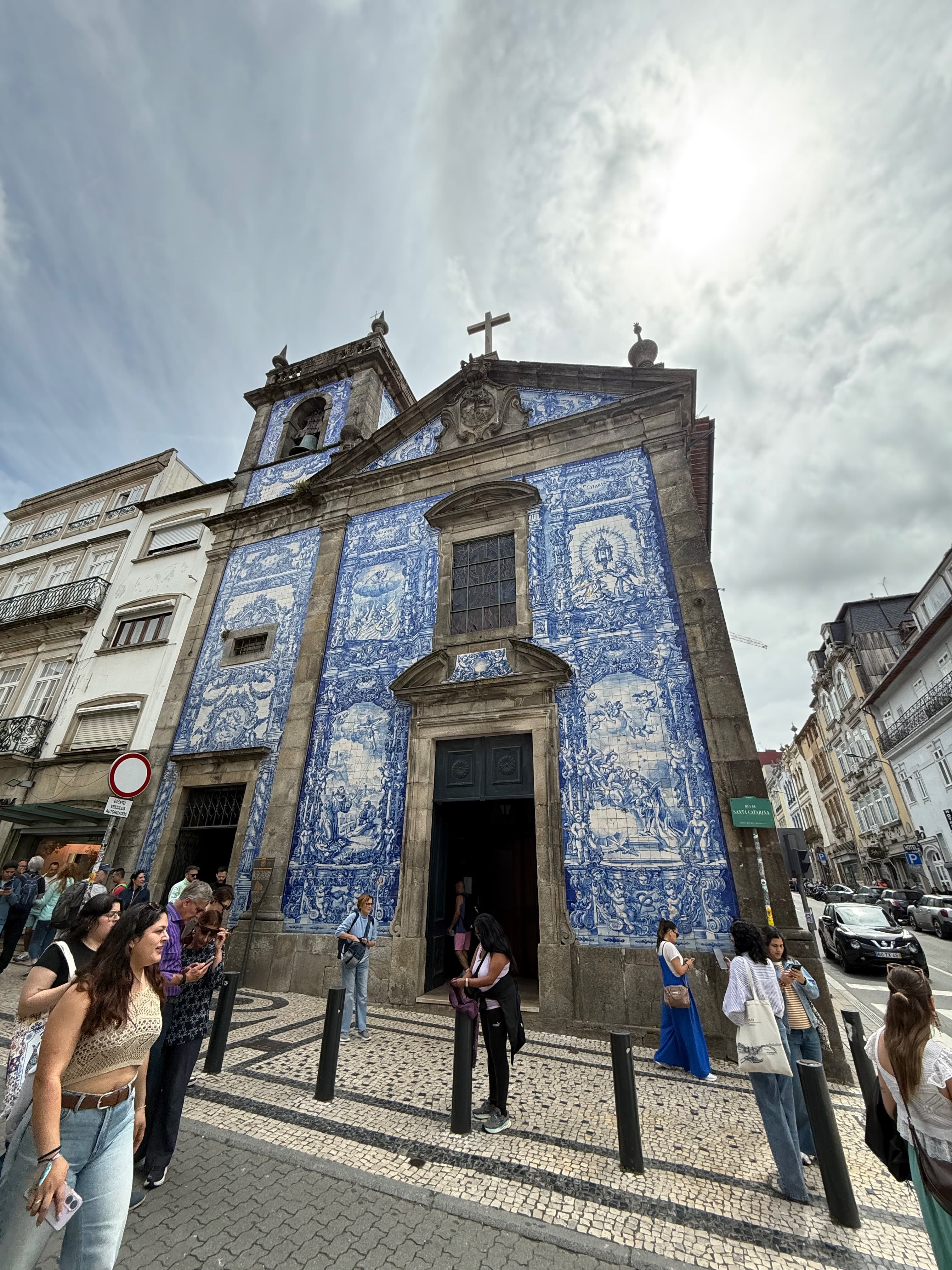 The striking front facade of the Chapel of Souls, wrapped entirely in traditional blue-and-white azulejo tiles.