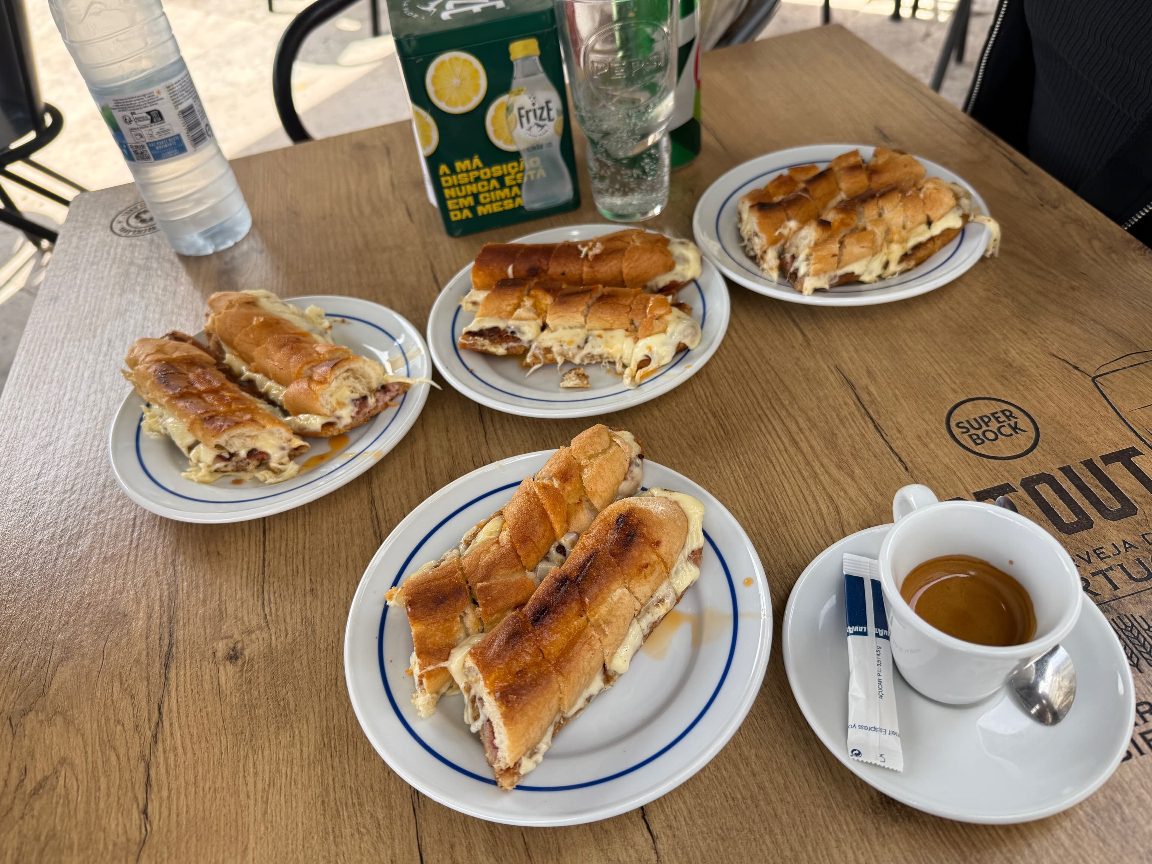 The famous crispy, cheesy Cachorrinho (Portuguese-style hot dog) served with espresso at Gazela.