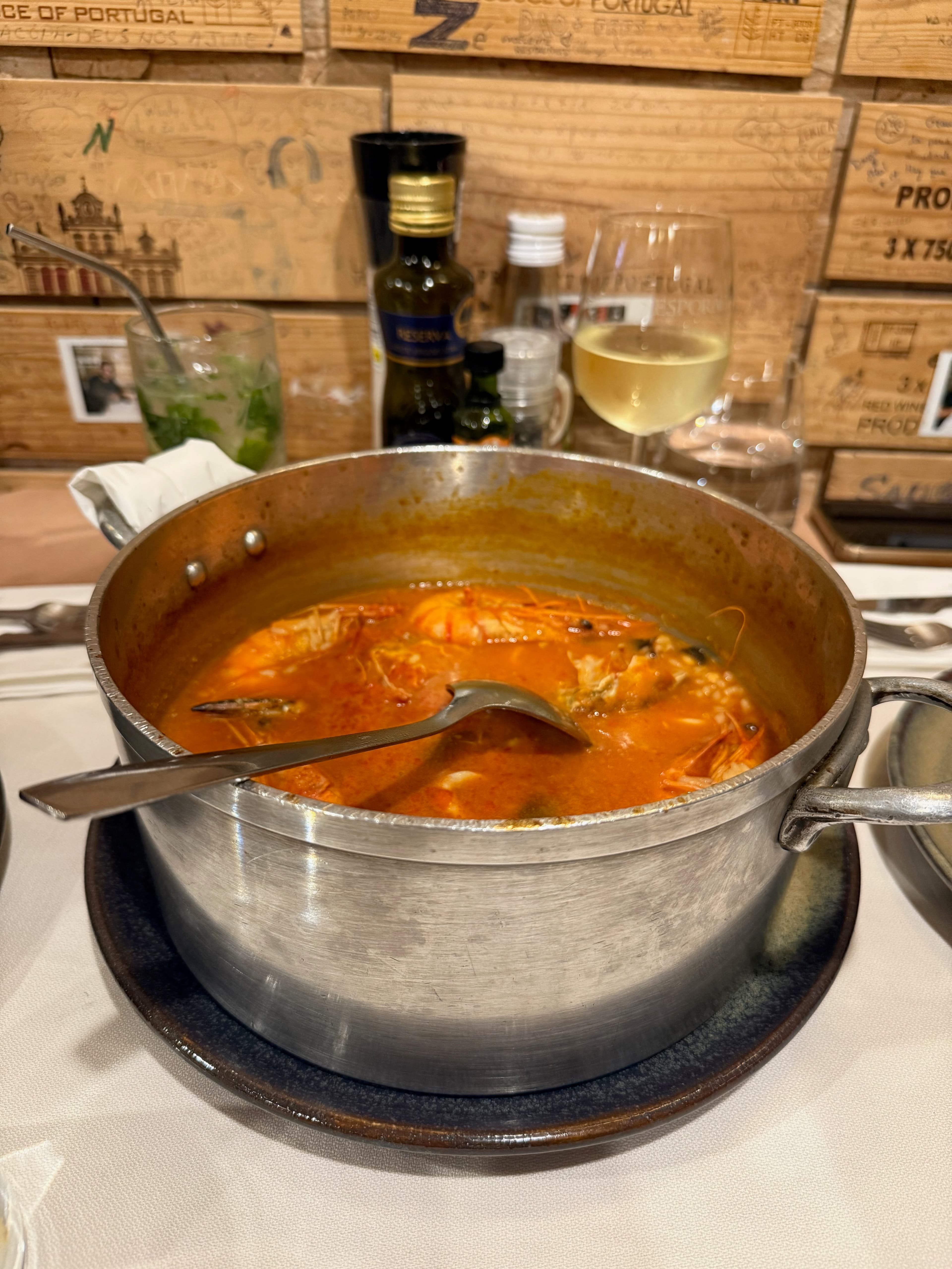 A delicious, hearty seafood rice dish served in a traditional clay pot at Zé Bota.